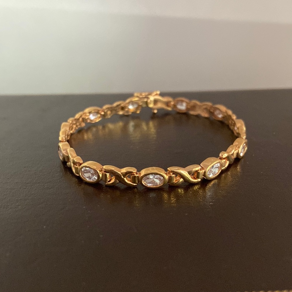 Sterling silver w gold plating bracelet. Oval rhinestones & elongated “Xs”. 7”.